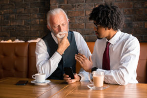 Younger and older employees working together